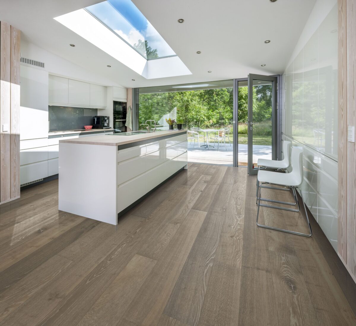 Decorated kitchen space with Kahrs Oak Nouveau Greige Prefinished Hardwood.