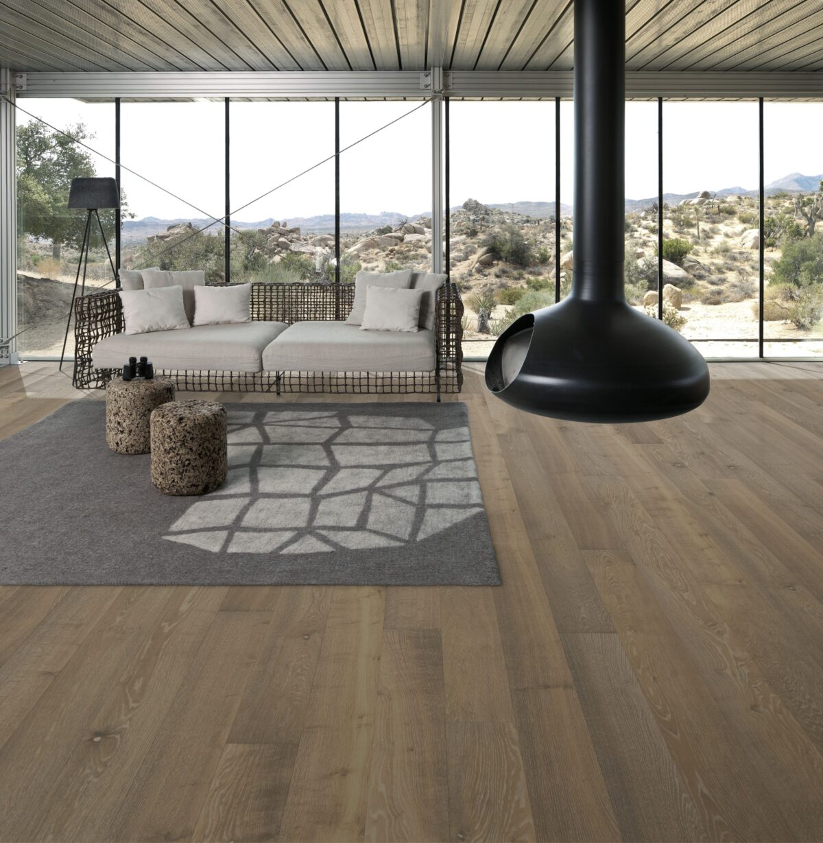 Decorated indoor room with natural lighting and Kahrs Oak Nouveau Greige Prefinished Hardwood.