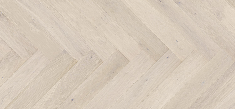 Close up of Barlinek Oak Trivor Herringbone Prefinished Hardwood.