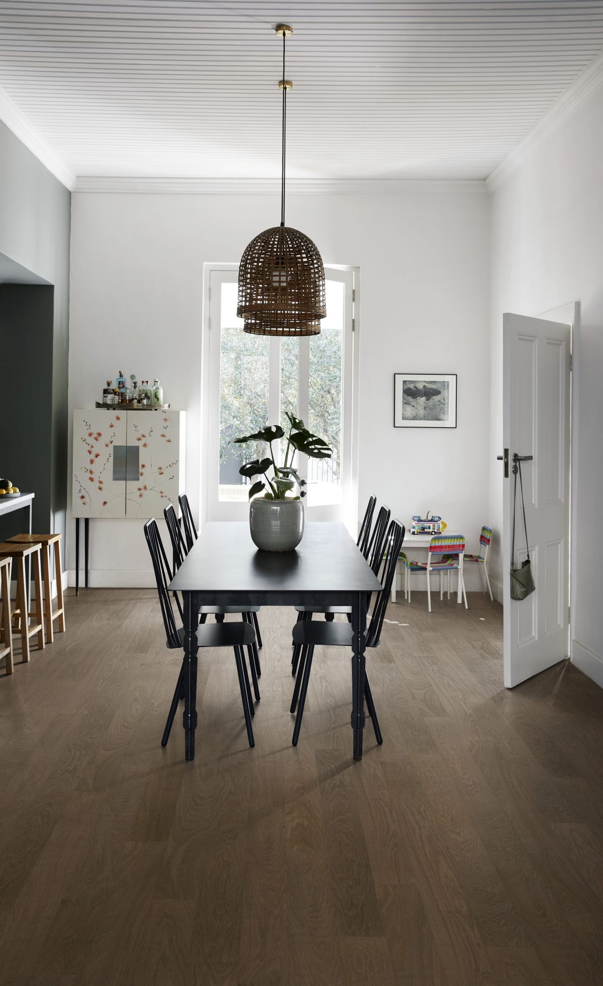 Decorated dining space with Kahrs Cocoa Bean Wide Prefinished Hardwood.