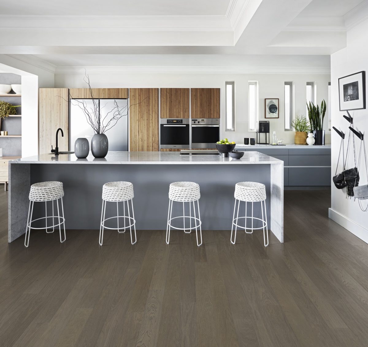 Decorated kitchen space with Kahrs Faded Black Wide Prefinished Hardwood.