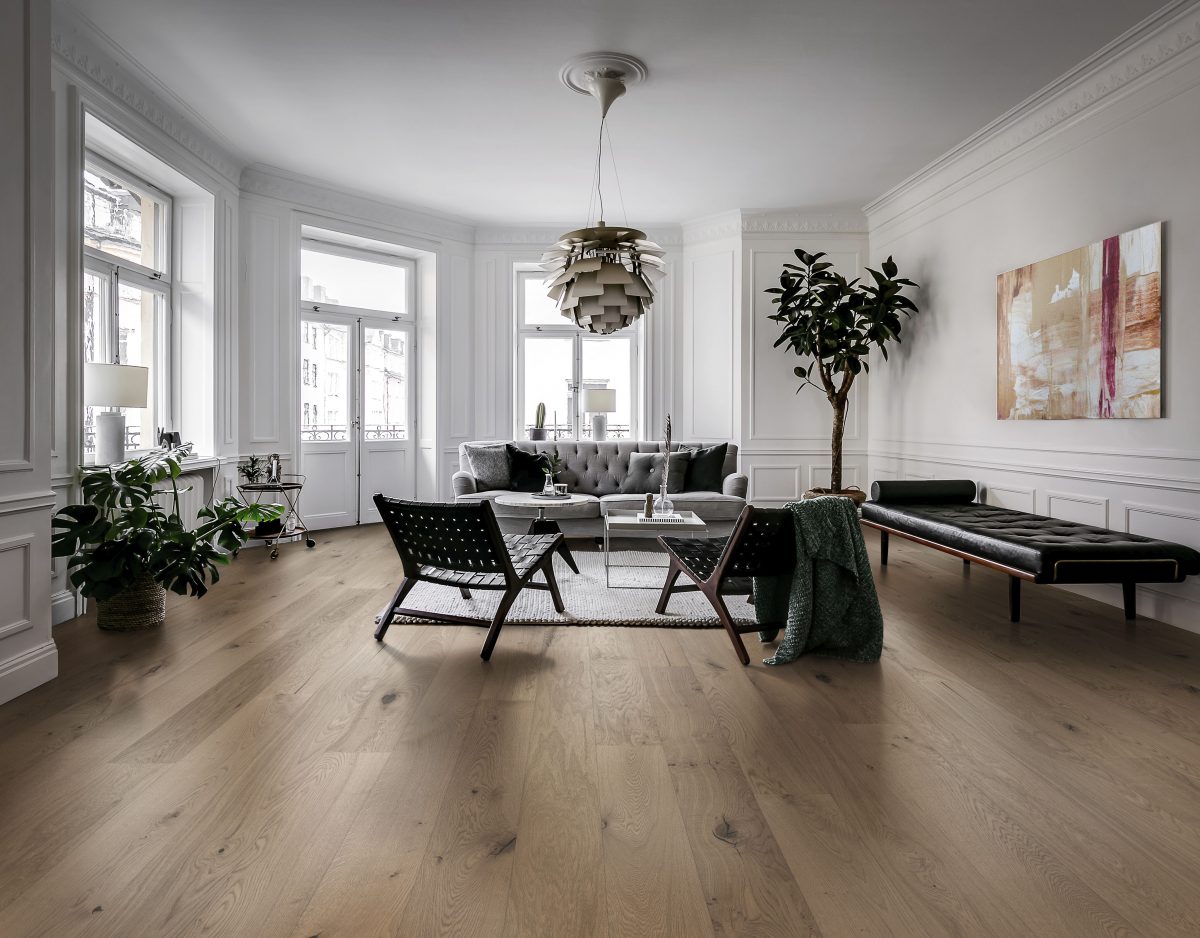 Decorated living room with Kahrs Frozen Hazelnut Plank Prefinished Hardwood.