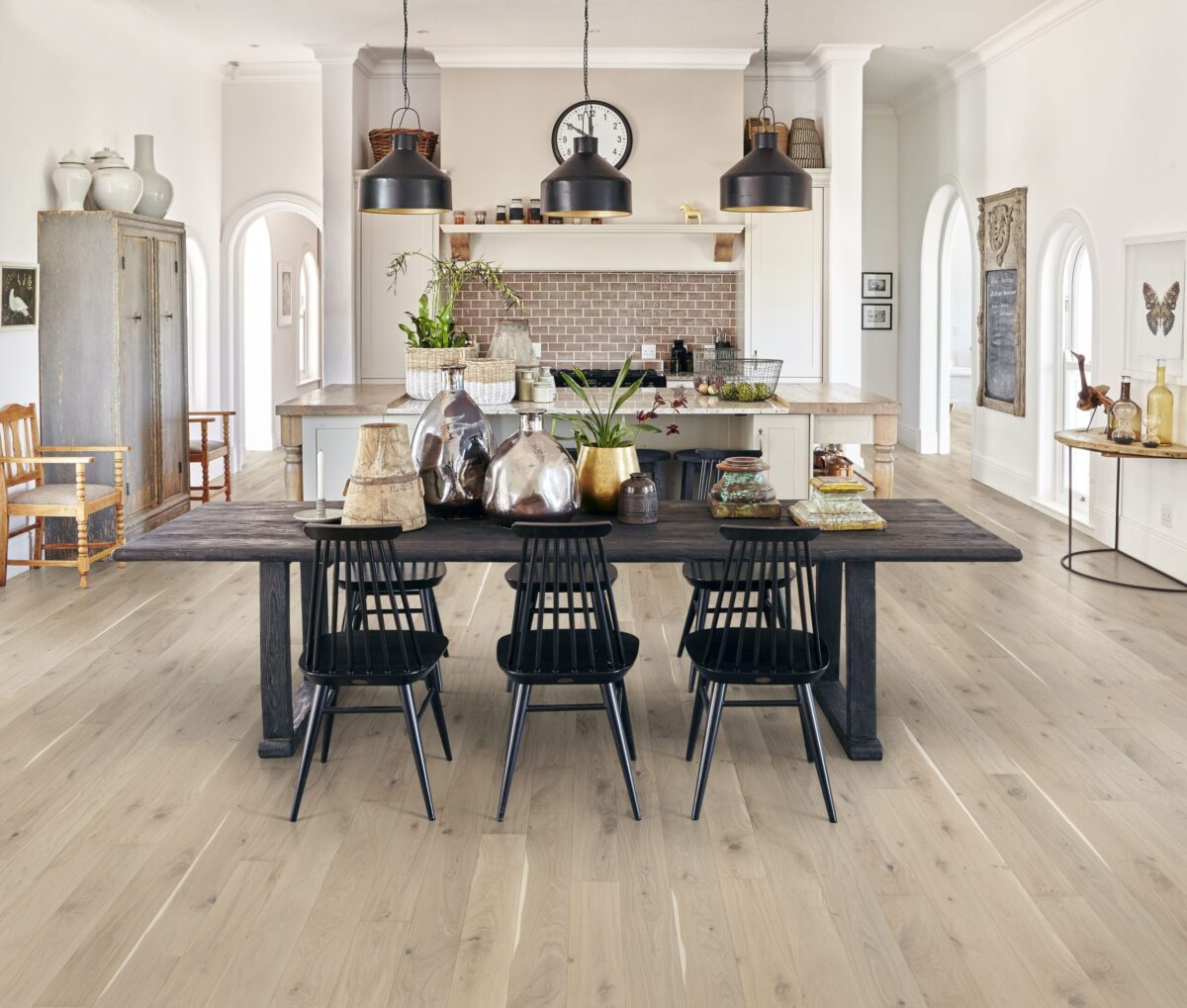 Decorated dining space with Kahrs Oak Ghost Prefinished Hardwood.