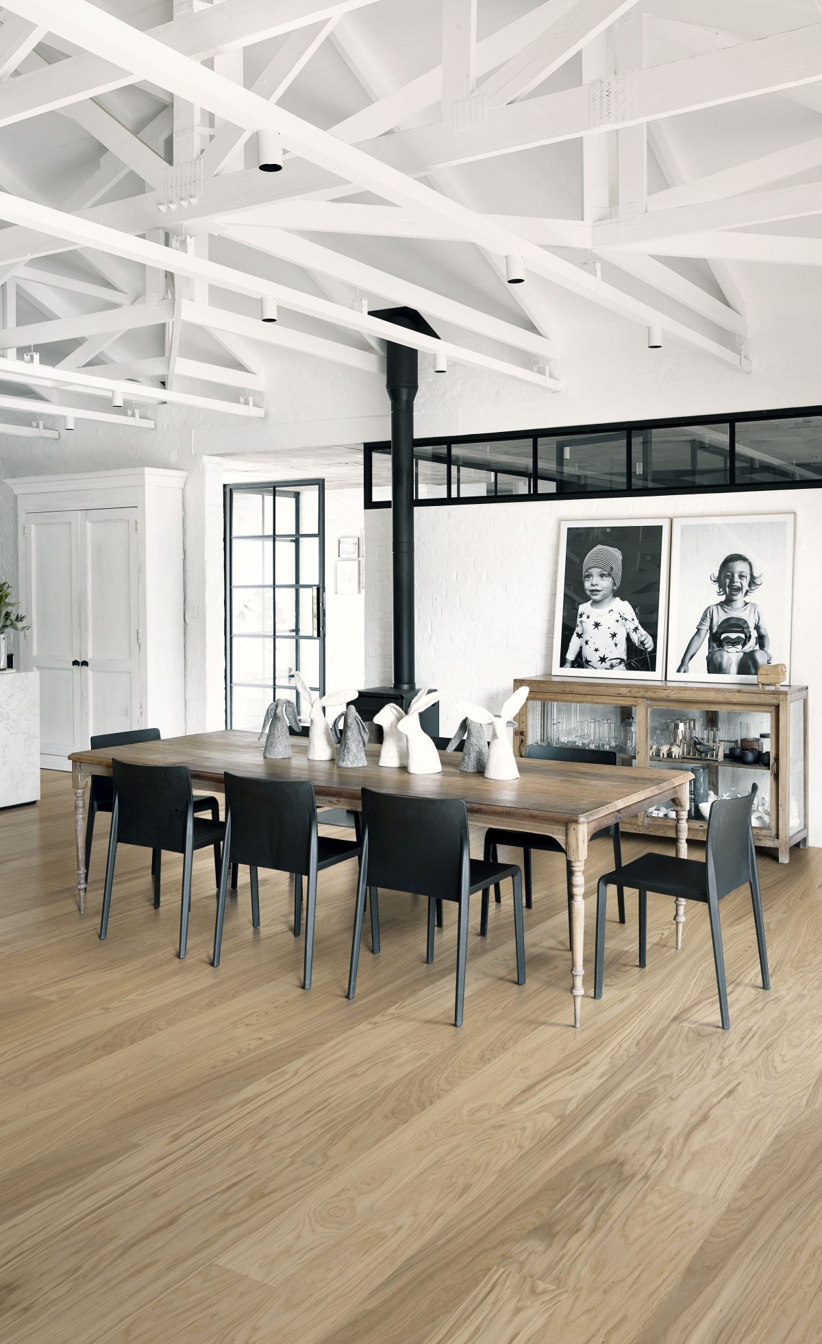 Decorated dining space with Kahrs Whole Grain Wide Prefinished Hardwood.