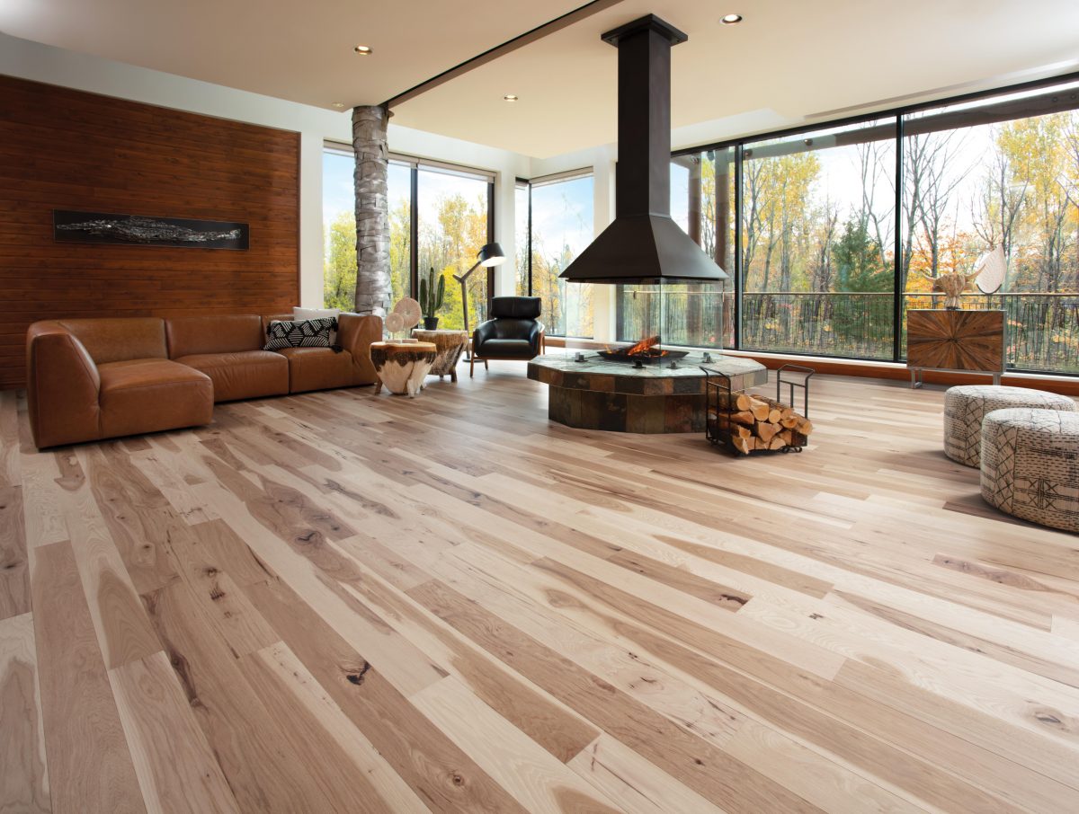 Decorated living room with Mirage Hickory Natural Character Brushed Prefinished Hardwood.