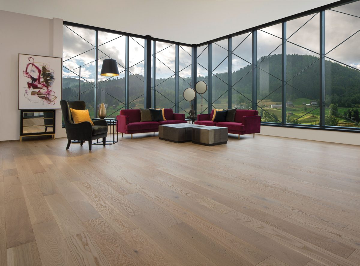 Decorated living room with Mirage White Oak Natural Character Brushed Prefinished Hardwood.