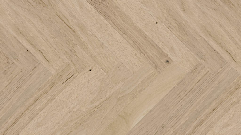 Close up of Barlinek Oak Balos Herringbone Prefinished Hardwood.