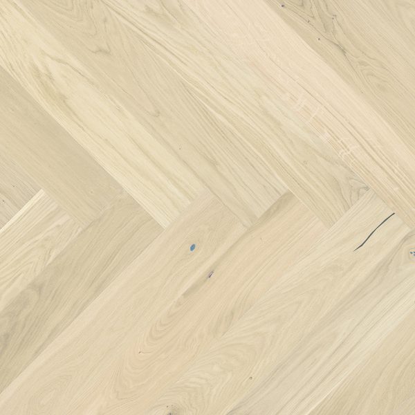 Close up of Barlinek Oak Bianco Herringbone Prefinished Hardwood.