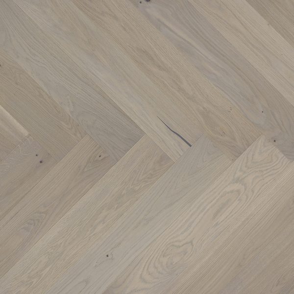 Close up of Barlinek Oak Marzipan Muffin Herringbone Prefinished Hardwood.