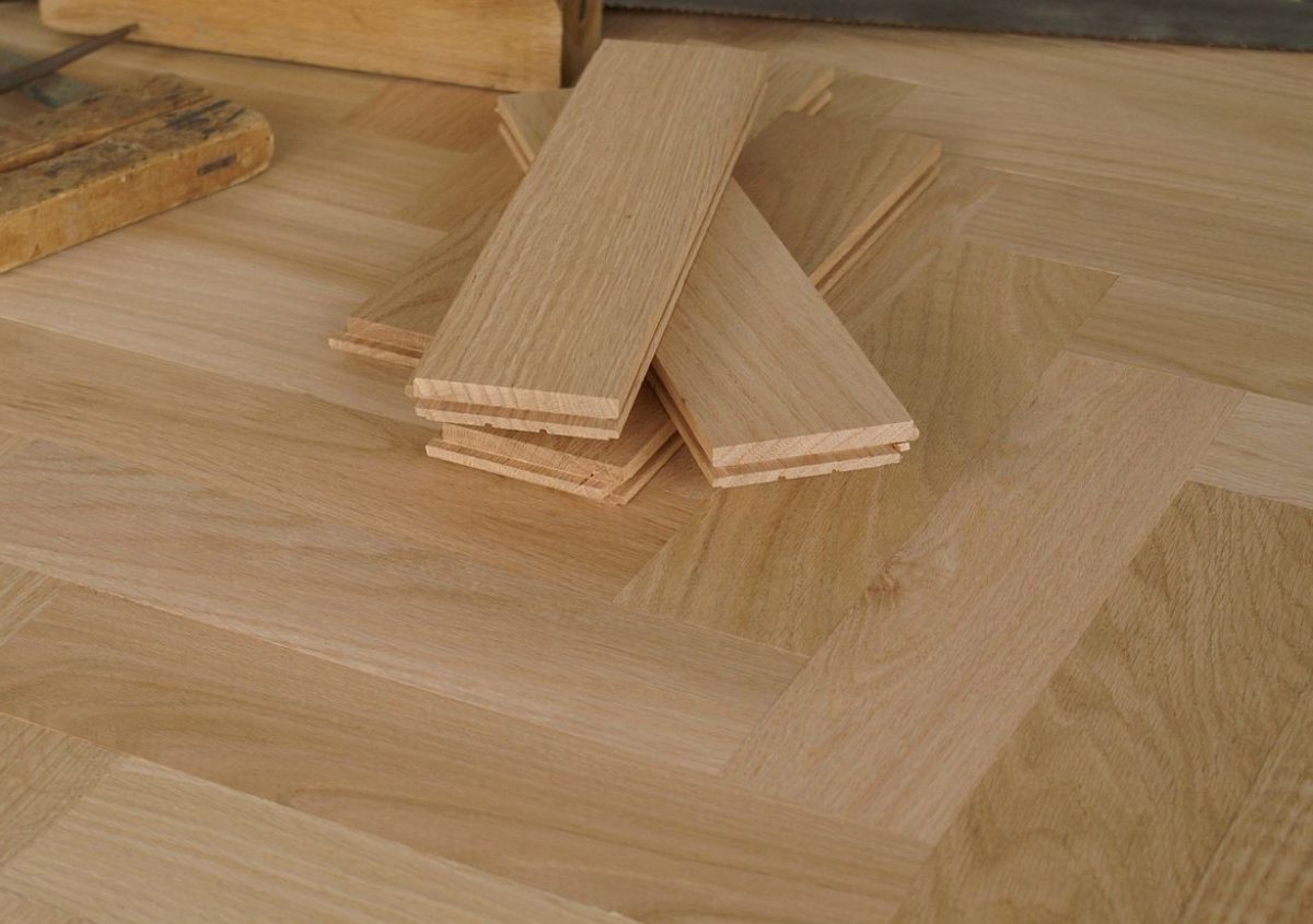 Decorated close up of Red Oak Herringbone Solid Unfinished Hardwood.