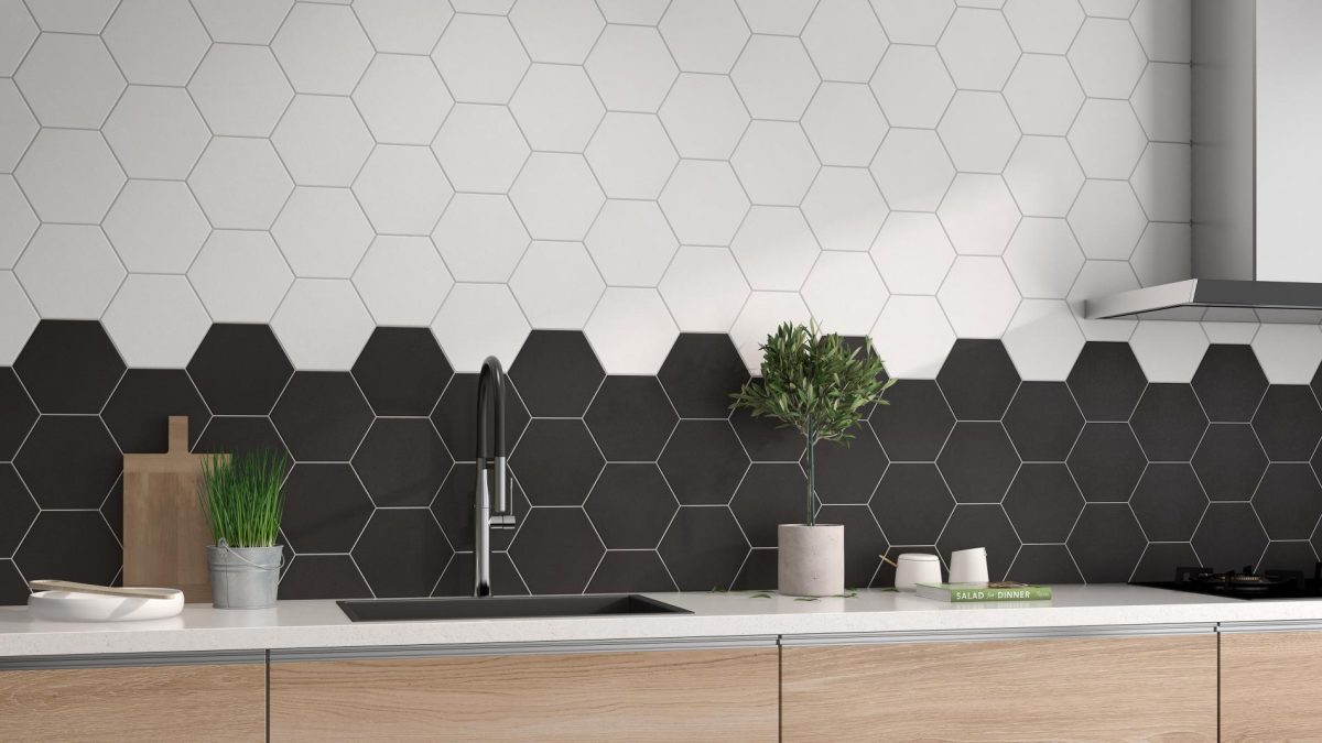 Decorated bathroom vanity with Pamesa Mayfair Hex Blanco And Mayfair Hex Negro Tiles And Stone.